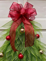 Juledekorationsguirlande til dør med sløjfe og ornamenter – Festlig døroppyntning